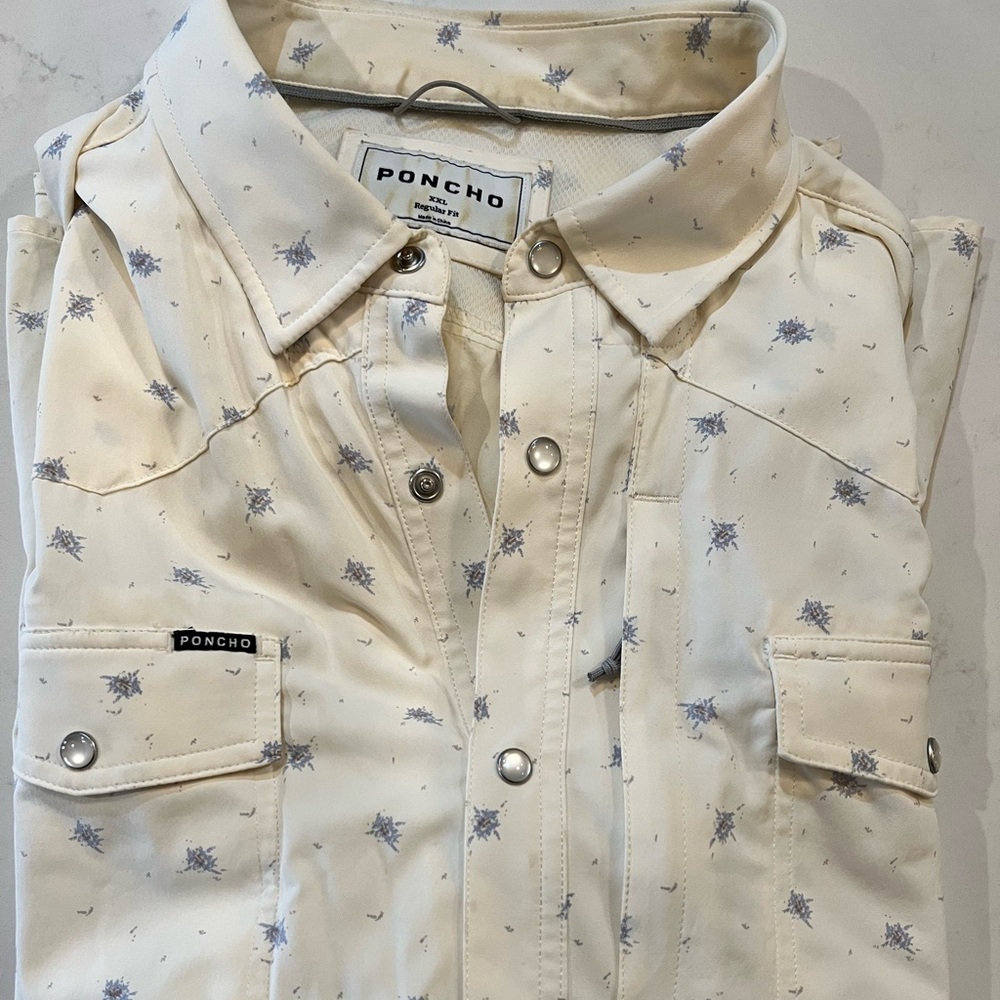 Men’s poncho short sleeve button downn snap front. Performance meets western.